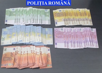 De la uniformă la cătușe. Polițist din Jimbolia, în centrul unei afaceri cu bani falși