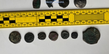 Polițiștii din Timiș, percheziție la angajatul unui muzeu, după ce mai multe monede medievale au dispărut